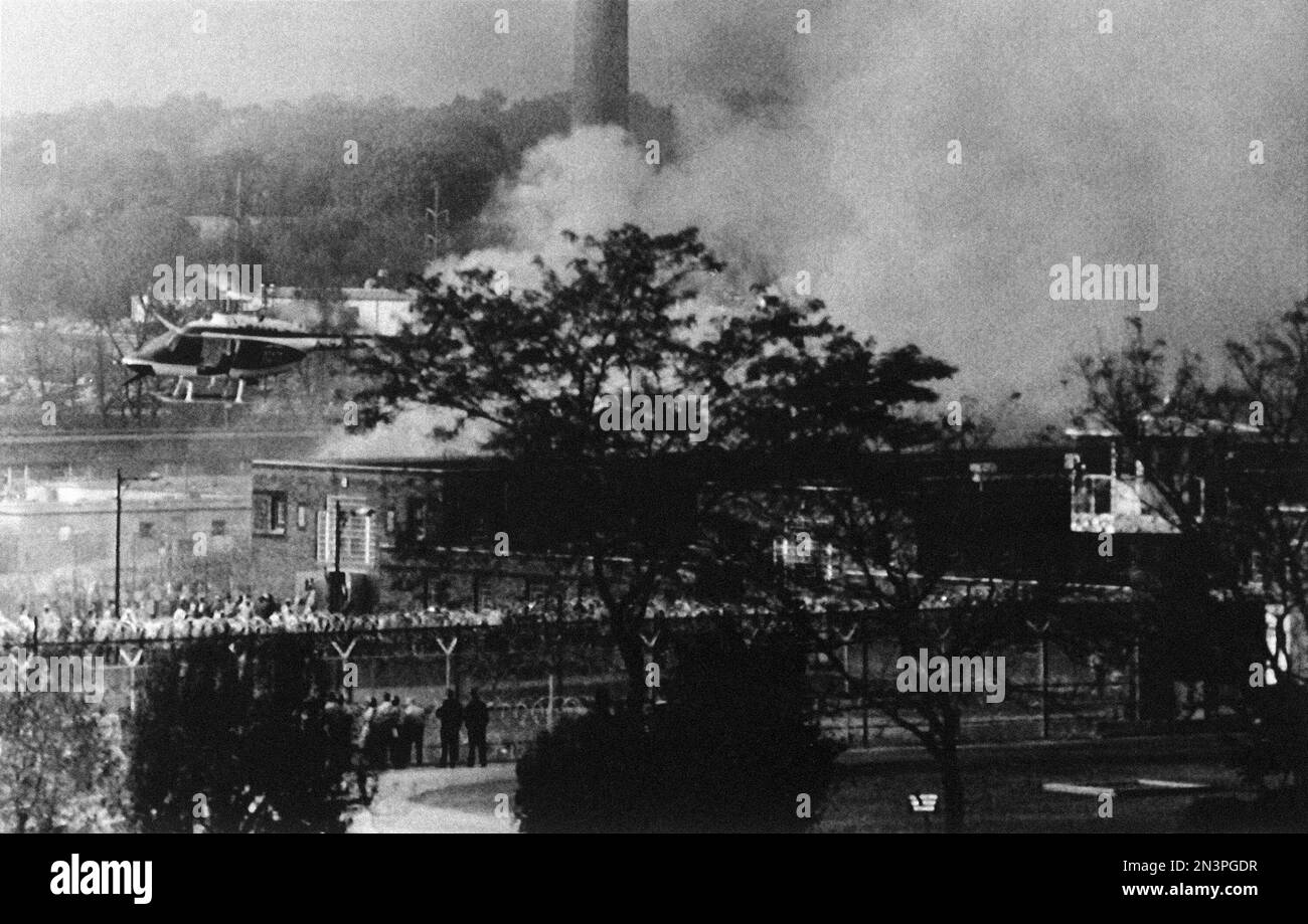 A Pennsylvania State Police helicopter hovers over the grounds of the ...