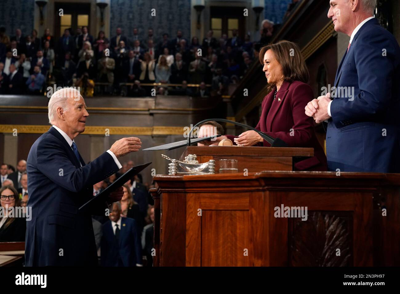 President Joe Biden hands copies of his speech to Vice President Kamala Harris and House Speaker Kevin McCarthy of Calif., at the State of the Union address to a joint session of Congress at the Capitol, Tuesday, Feb. 7, 2023, in Washington. Credit: Jacqueline Martin/Pool via CNP /MediaPunch Stock Photo