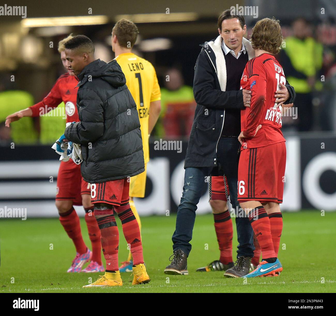 Leverkusen's head coach Roger Schmidt, center right, embraces Leverkusen's  Tin Jedvaj after the Champions League group C soccer match between Bayer 04  Leverkusen and Zenit in Leverkusen, Germany, Wednesday, Oct. 22, 2014.(AP