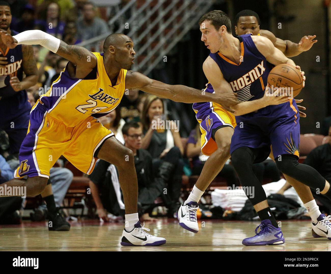 Los Angeles Lakers' Kobe Bryant, left, pressures Phoenix Suns' Goran