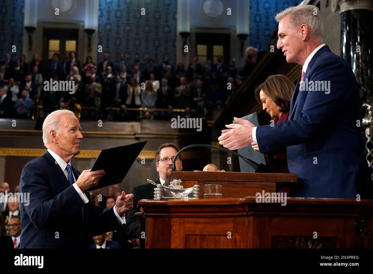 Washington. 7th Feb, 2023. President Joe Biden hands a copy of his speech to House Speaker Kevin McCarthy of Calif., at the State of the Union address to a joint session of Congress at the Capitol, Tuesday, Feb. 7, 2023, in Washington. Credit: Jacqueline Martin/Pool via CNP/dpa/Alamy Live News Stock Photo