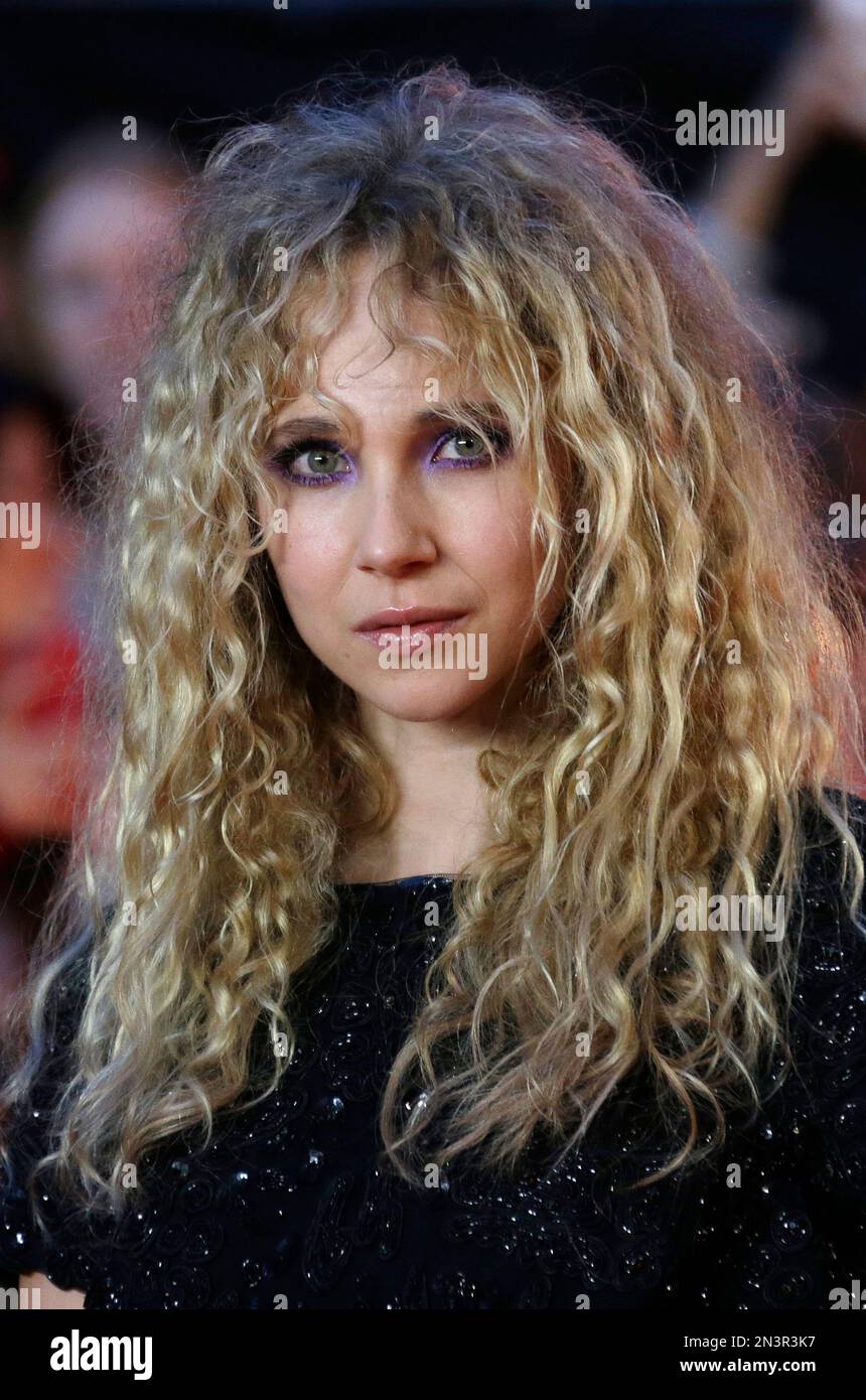 Actress Juno Temple poses for photographers upon arrival at the