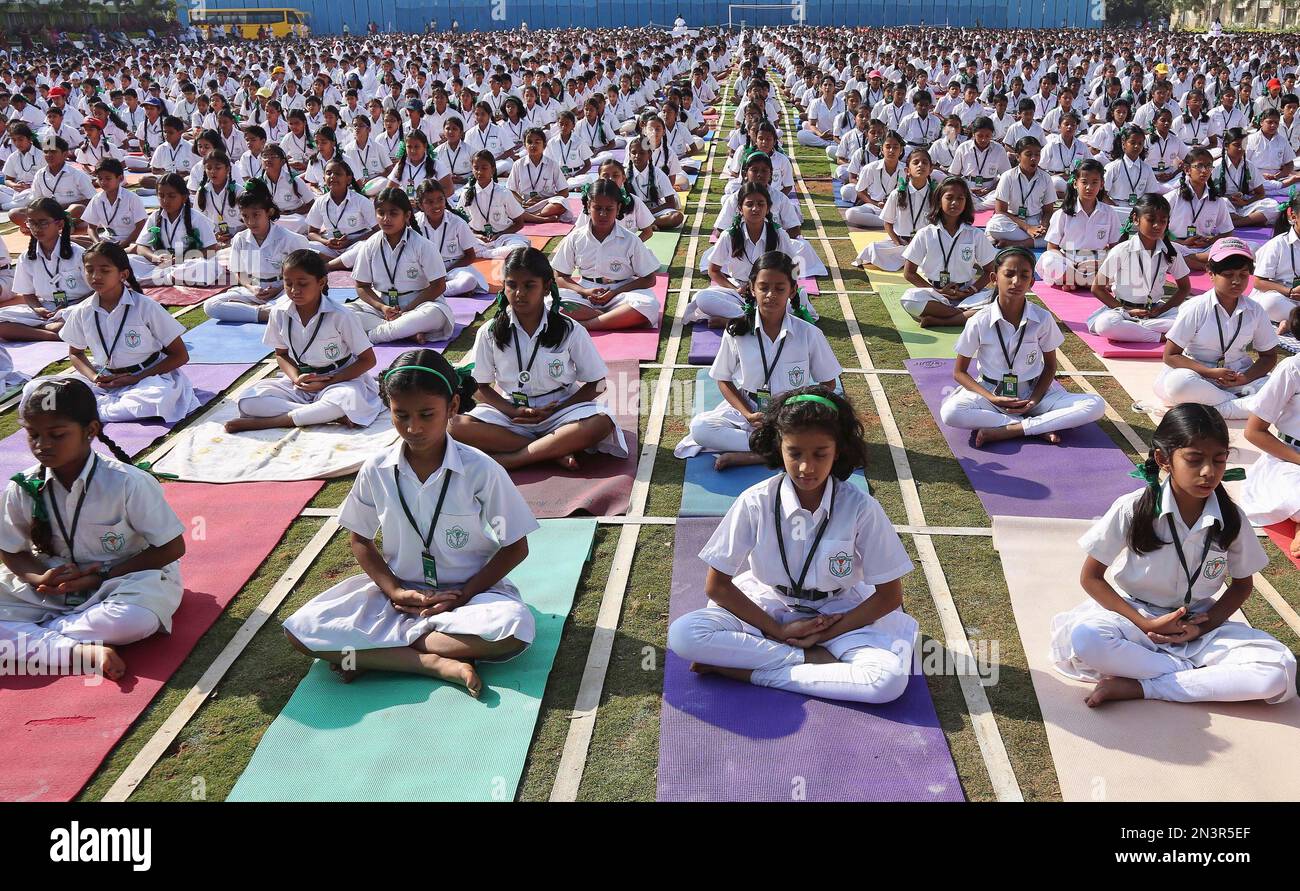 Indian schoolchildren perform yoga at Delhi Public School in Hyderabad ...