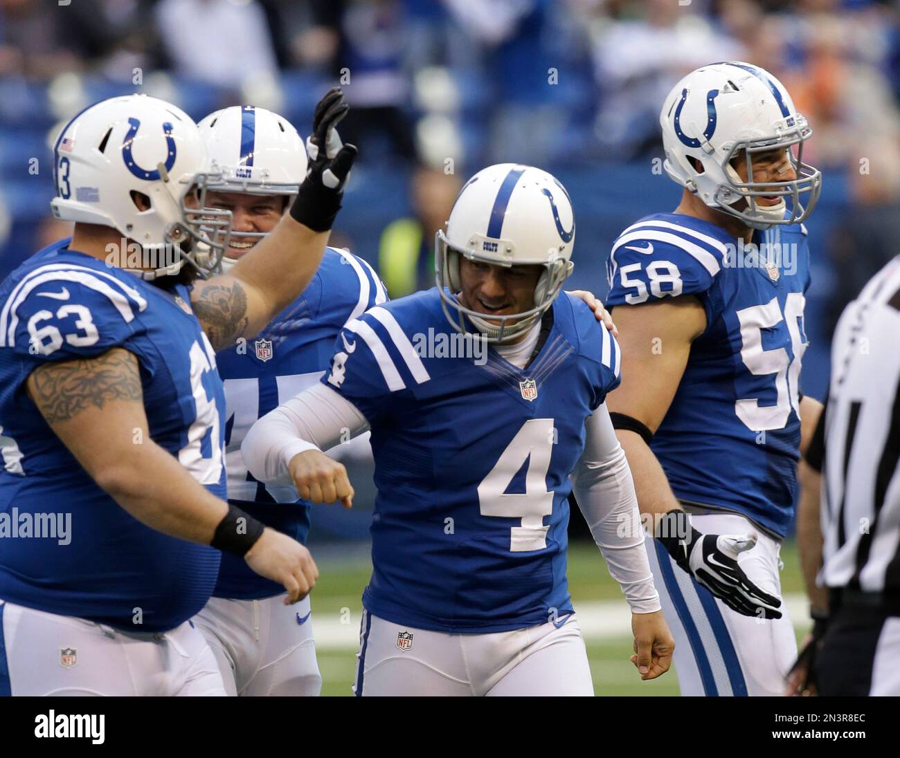 Indianapolis Colts kicker Adam Vinatieri (4) reacts with teammates