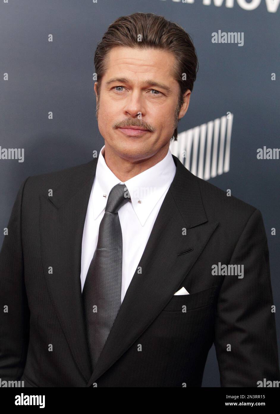 Actor Brad Pitt arrives for the world premiere of “Fury” at the Newseum ...