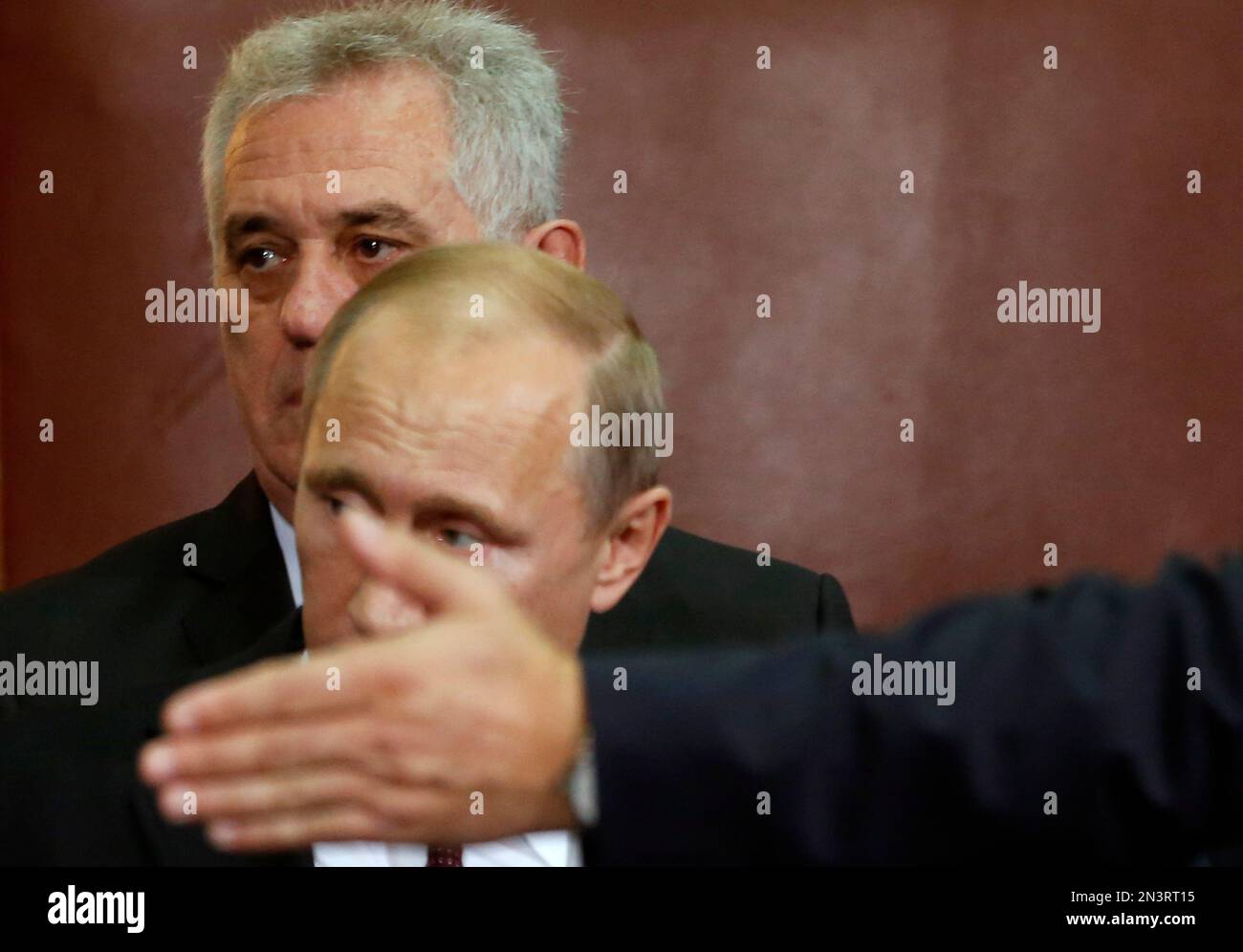 Russian President Vladimir Putin, center, arrives at a press conference ...
