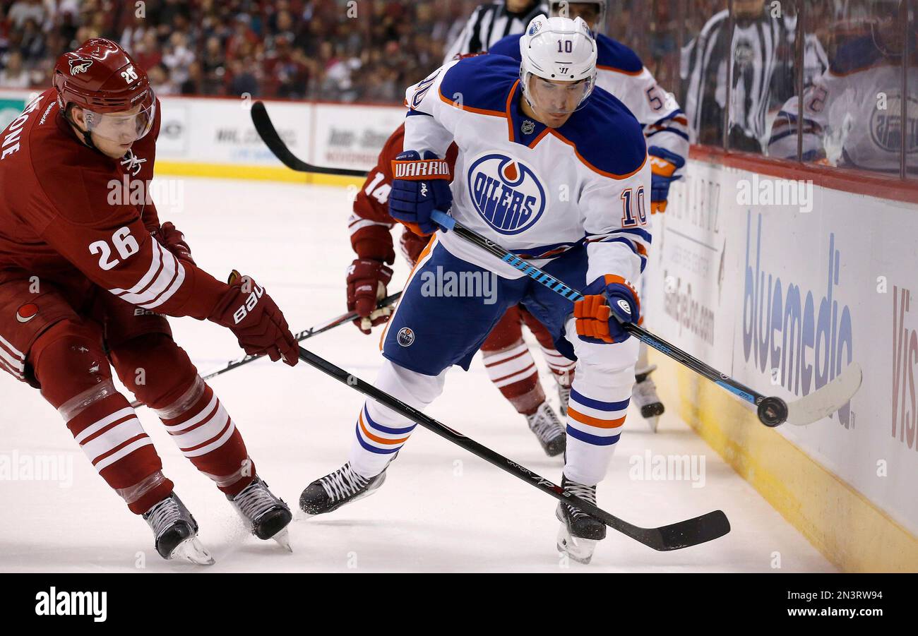 Edmonton Oilers' Nail Yakupov (10), of Russia, flips the puck away from