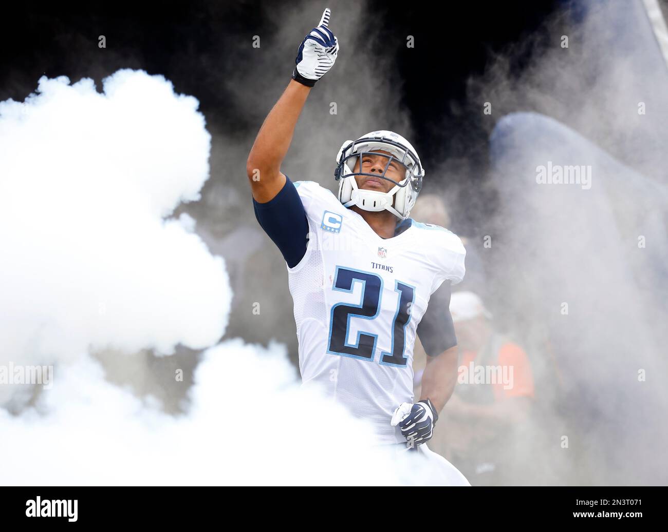 Tennessee Titans free safety George Wilson (21) comes out of the smoke  during team introductions an NFL football game Sunday, Oct. 12, 2014, in  Nashville, Tenn. (Jeff Haynes/AP Images for Panini Stock