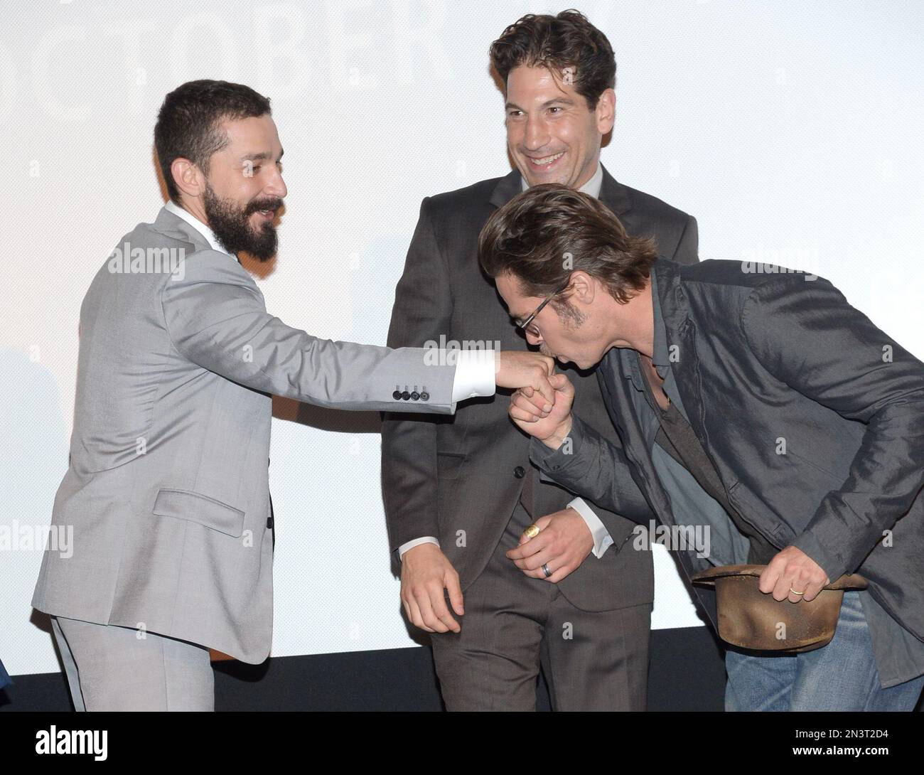 From left, Shia LaBeouf, Jon Bernthal and Brad Pitt arrive at the New