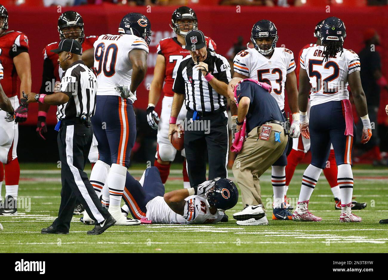 Chicago Bears free safety Chris Conte (R) is tacked by Minnesota Vikings  fullback Jerome Felton after returning an interception 35 yards during the  second quarter at Soldier Field on November 25, 2012