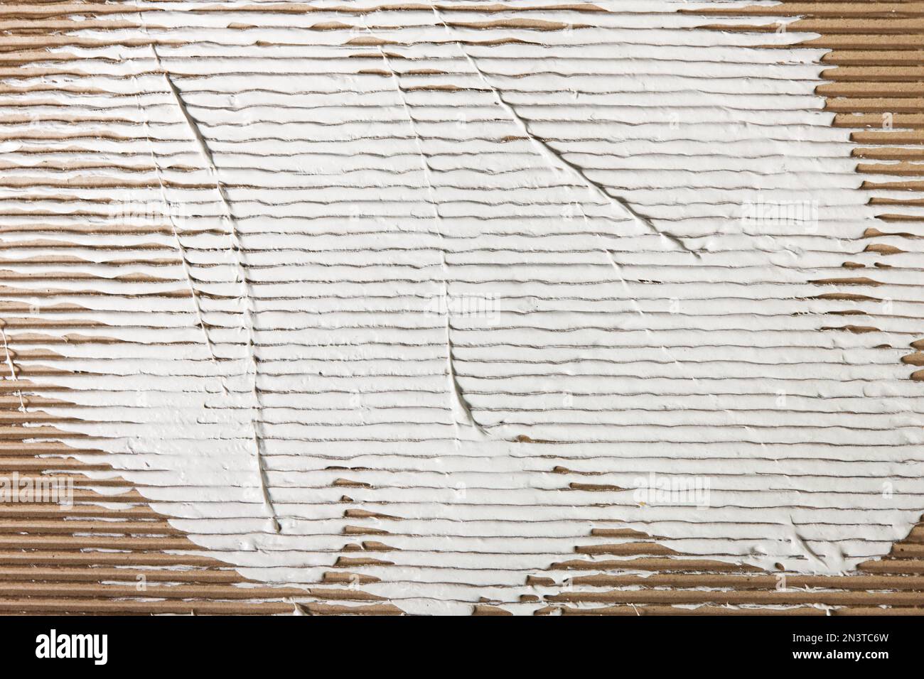 White plaster spreaded on cardboard background Stock Photo Alamy