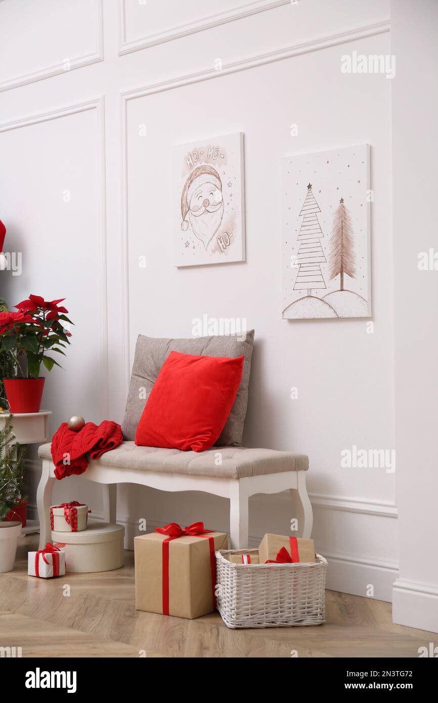 Christmas themed pictures in bright room with festive decorations