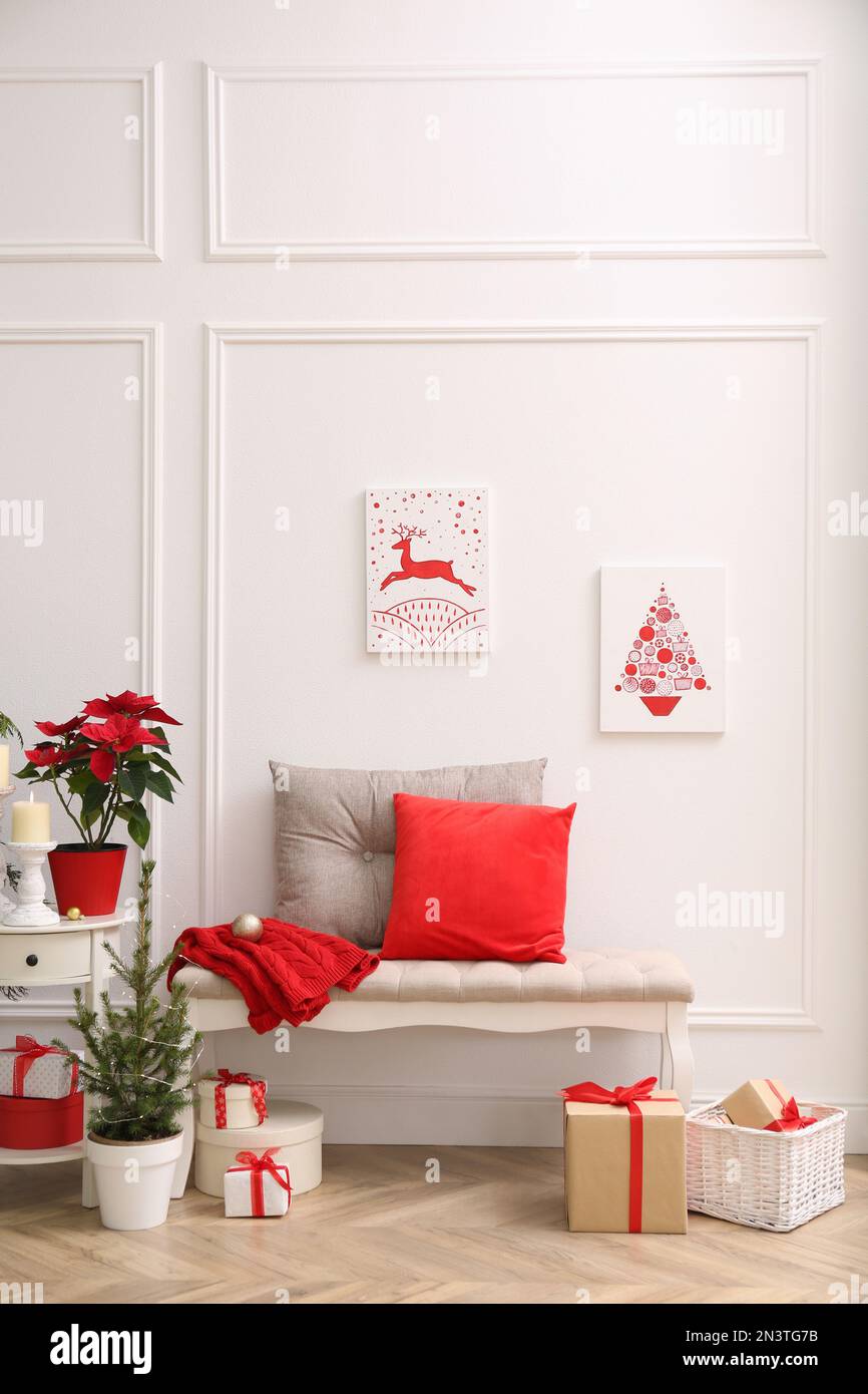 Christmas themed pictures in bright room with festive decorations