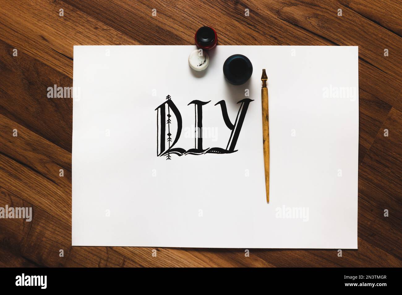 Calligraphy word and tools Stock Photo