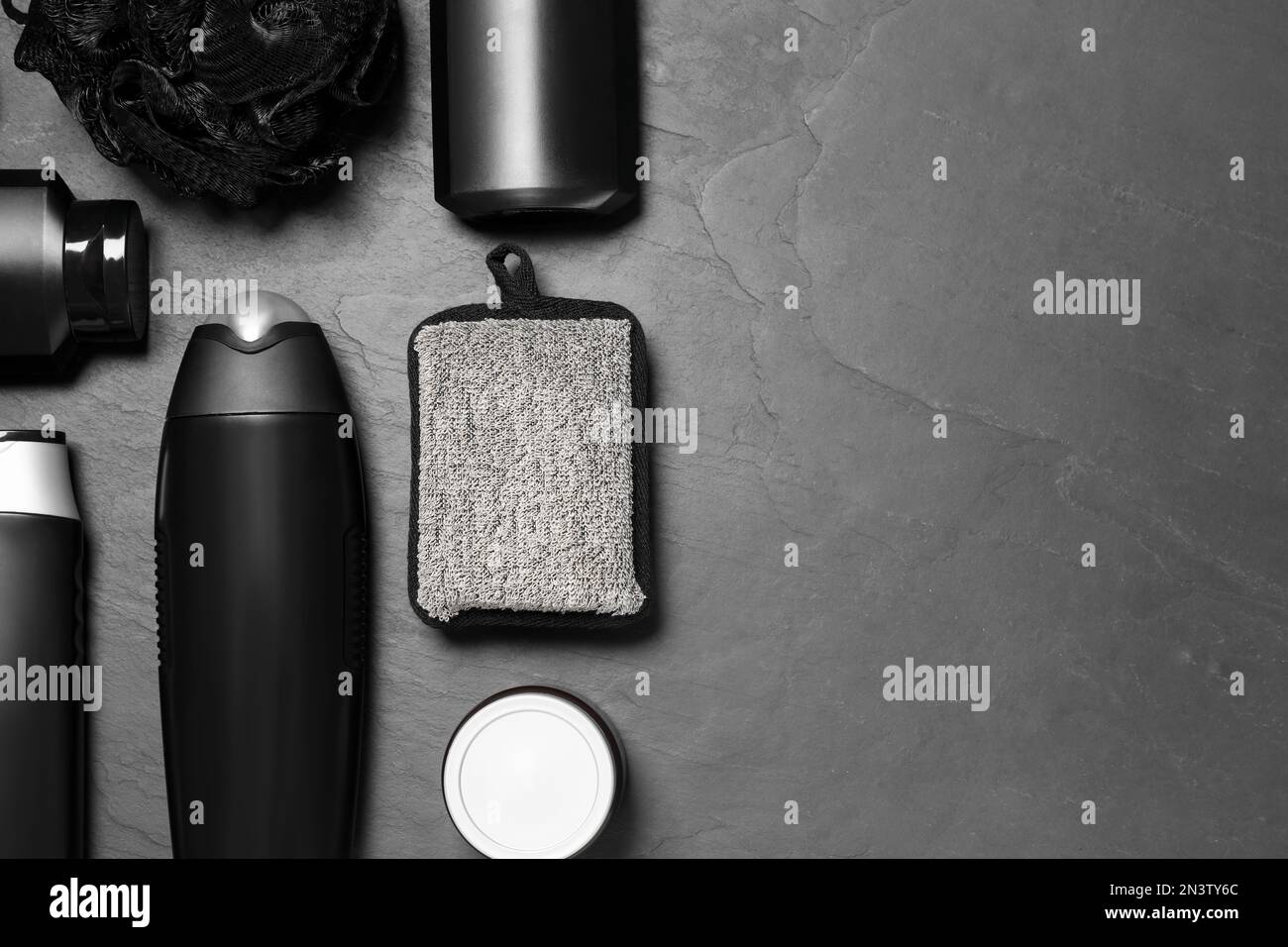 Flat lay composition with men's cosmetic products on grey background ...
