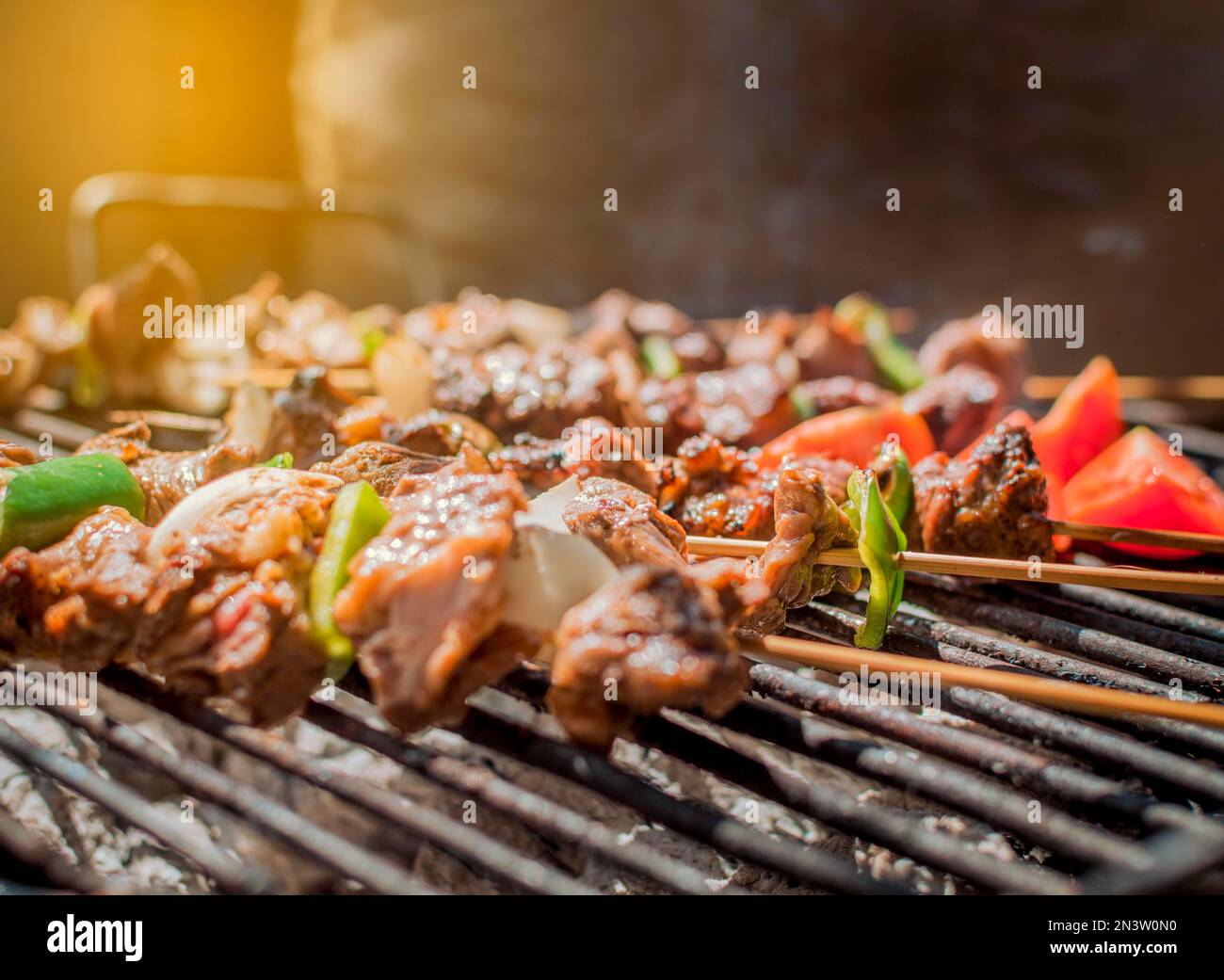Roast beef skewers on a grill, Roast beef skewers grilling on a grill Stock Photo Alamy