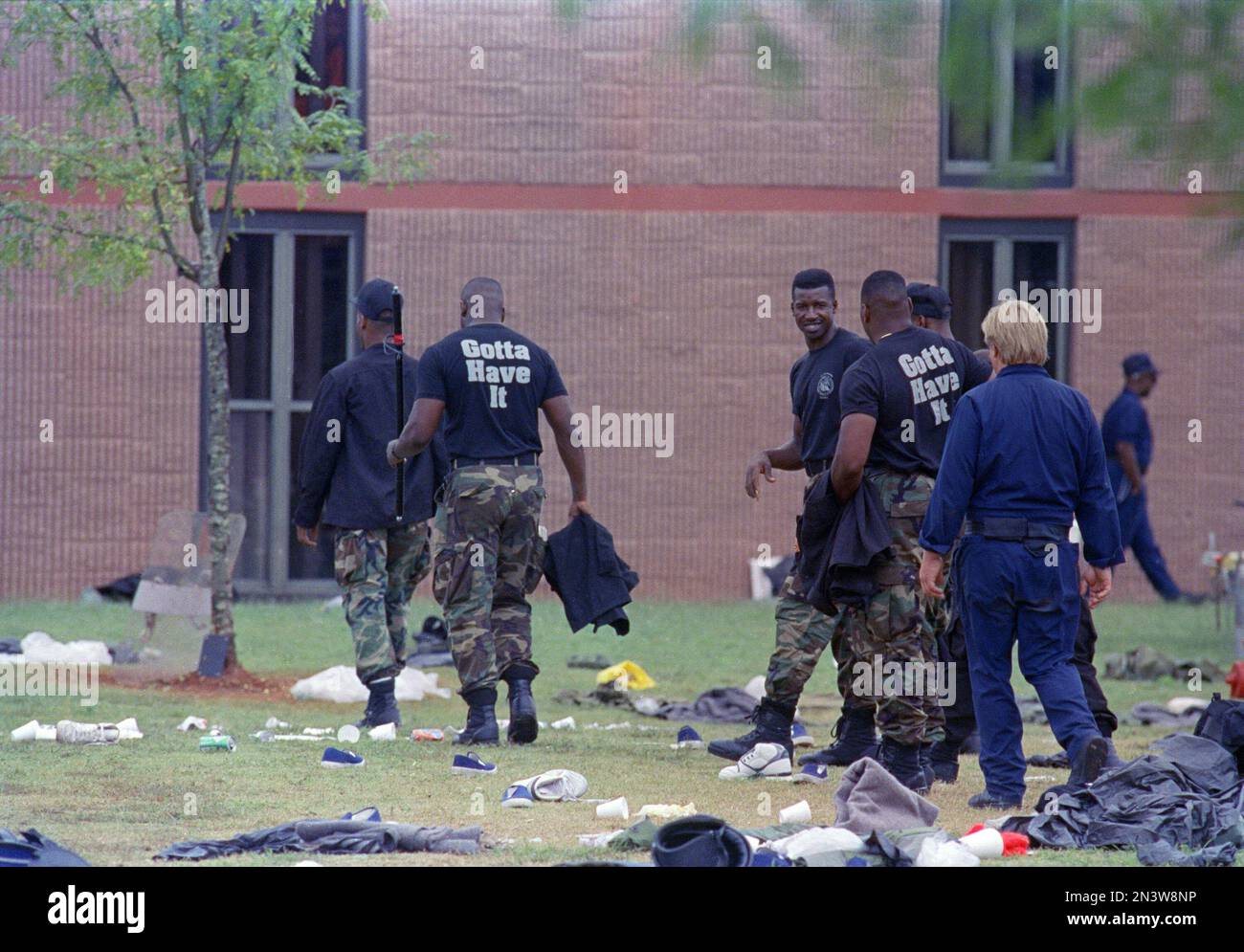 Members of rescue teams round up their gear after storming the Alpha