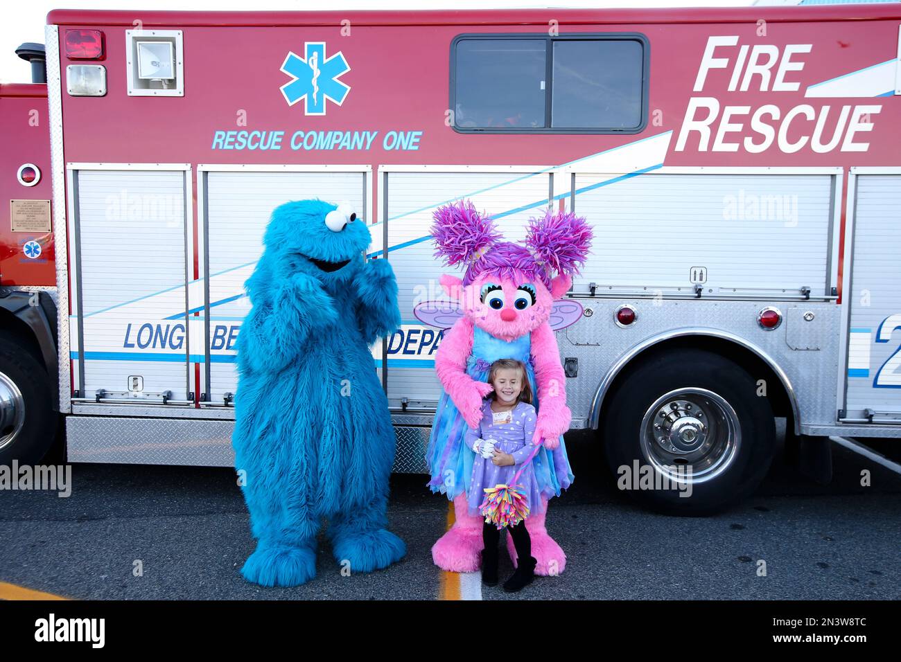 Sesame Street’s Abby Cadabby and Cookie Monster greet children as the ...