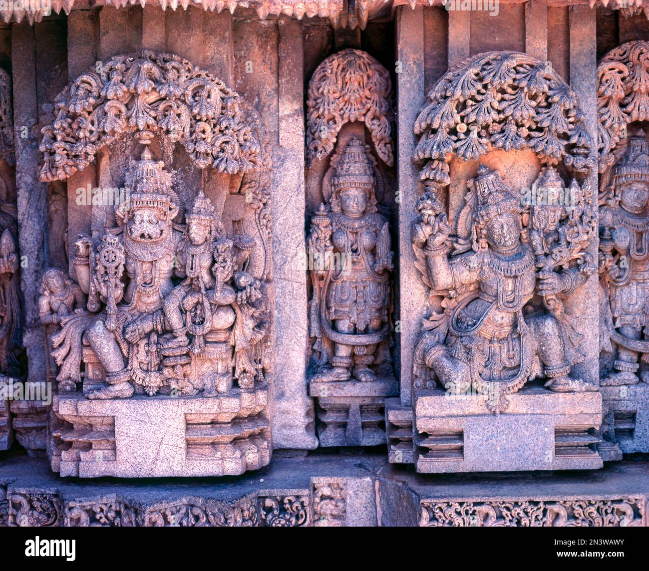 13th century Hoysala sculptures of Lakshmi, Narasimba and garuda carrying LakshmiNarayana in Prasanna Chennakeshava temple in Somnathpur, Karnataka Stock Photo