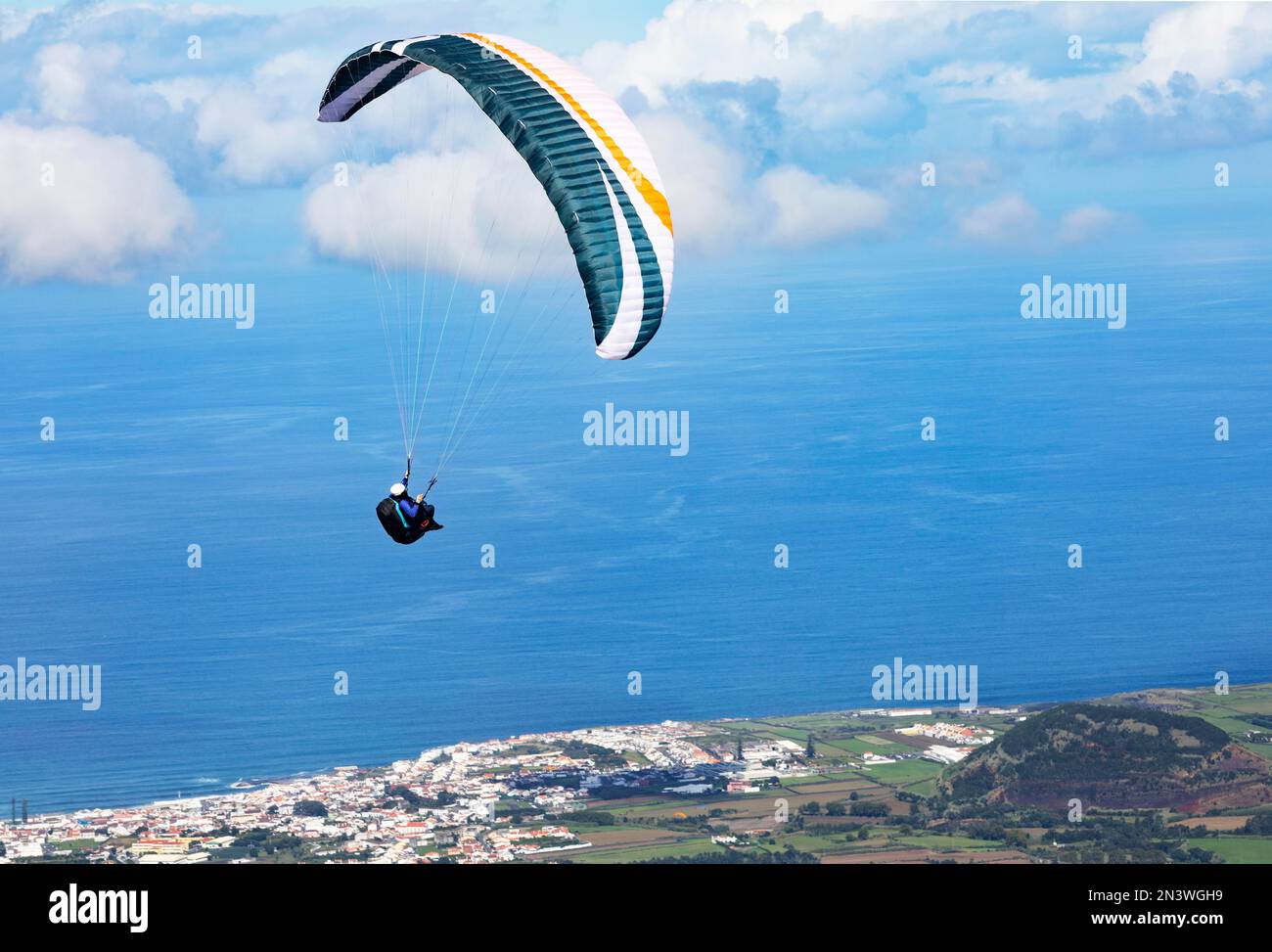 Paragliders after take-off from Pico Barrosa with a view over the island of Sao Miguel, Azores, Portugal Stock Photo