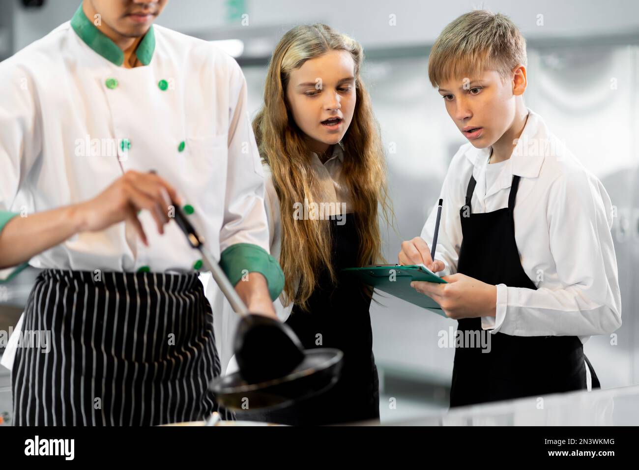 Students are learning to cook in a culinary institute with a standard ...