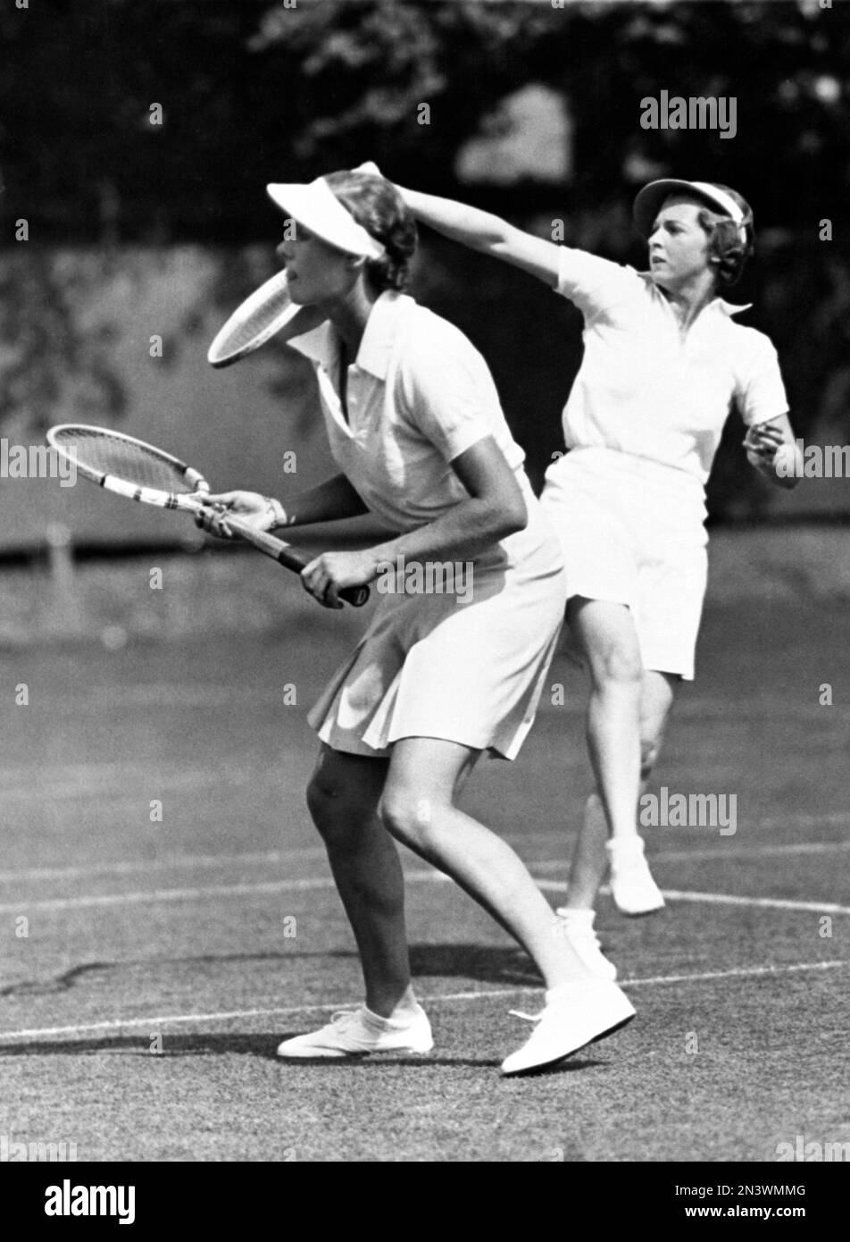 Freda James, right, makes a shot behind her partner, Kay Stammers, when the  English pair played in the semi-finals of the Women's Doubles Championship  and defeated the USA team in Brookline, Massachusetts,