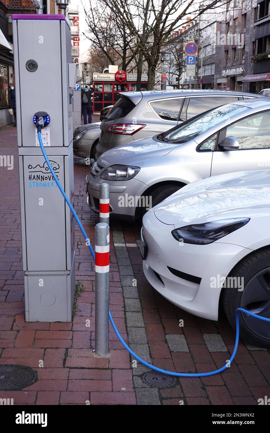 Hannover, Germany December 4, 2021 Electric car parking at public EV charging station on city