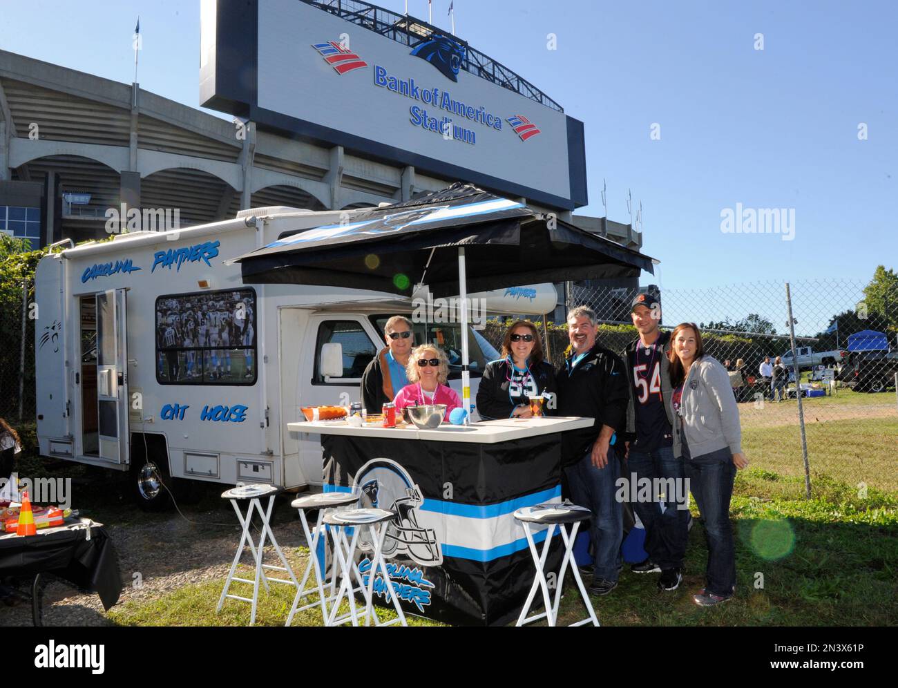 Chicago Bears and Carolina Panthers fans pose for a photo as they