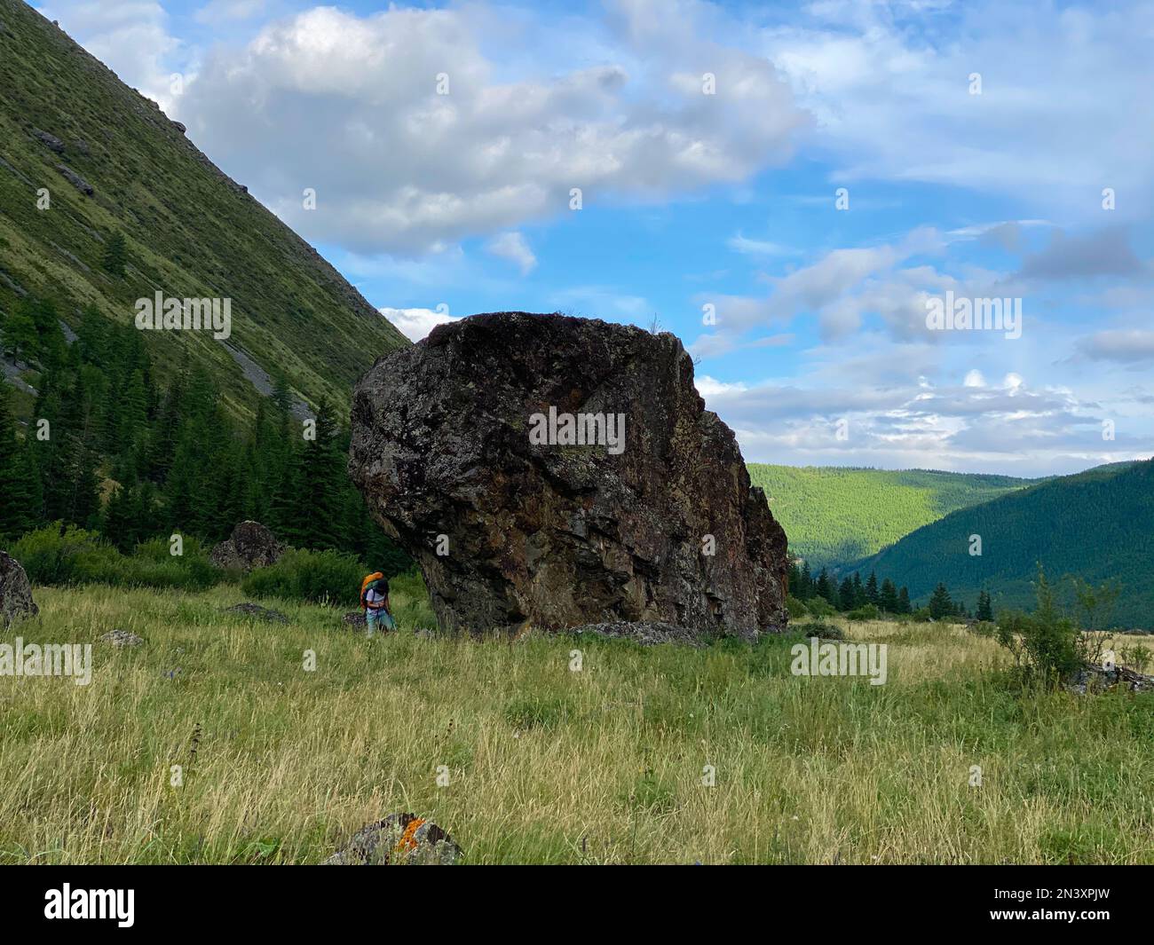 Female traveler walks on rock hi-res stock photography and images - Alamy