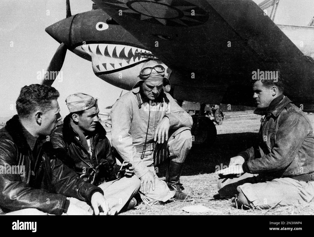 American Volunteer Group, or AVG pilots sit in front of a P40 airplane in Kunming, China, March
