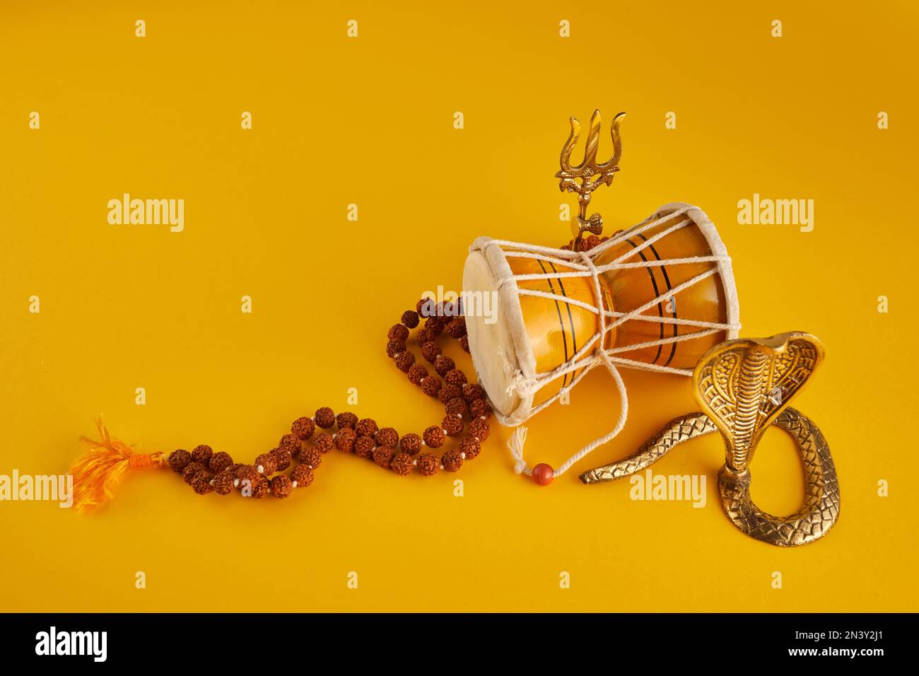 Shivaratri background with Shivas trident, Pellet Drum Damroo musical ...