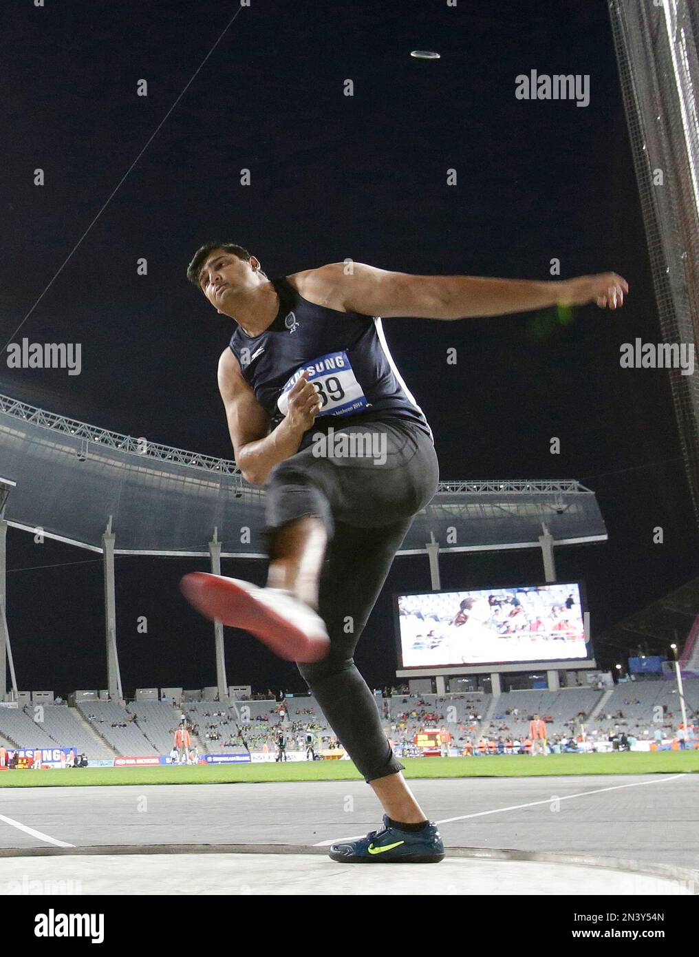 India's Vikas Gowda competes in men's discus throw final at the 17th ...