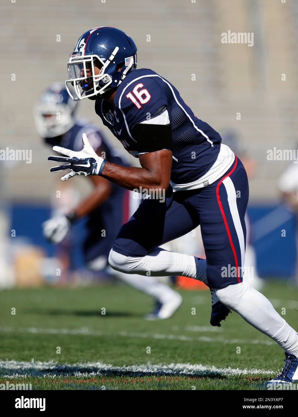 Connecticut cornerback Byron Jones (16) runs a drill before an NCAA