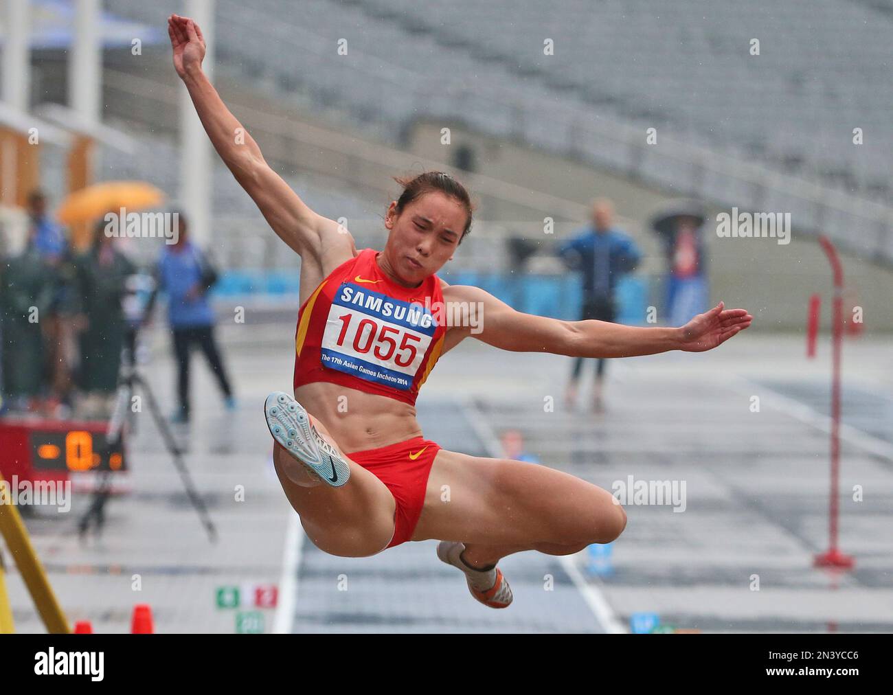 China's Wang Qingling competes in the women's heptathlon long jump at ...