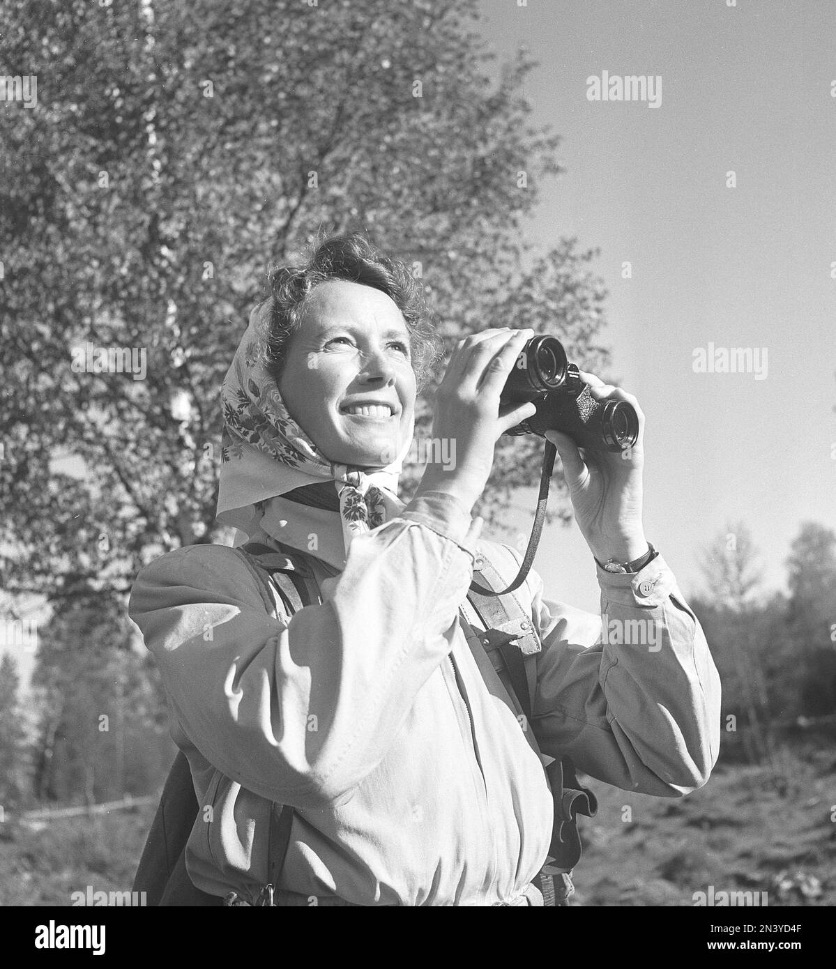 1940s outdoor life. A woman is out in the nature with an interest in