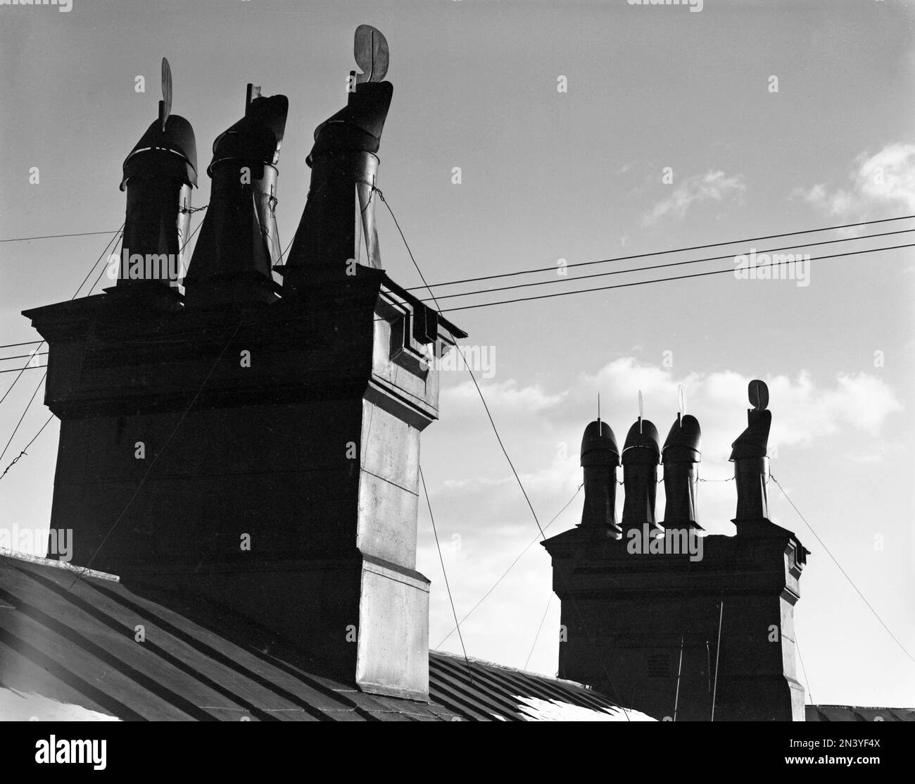 In the 1950s. Detail of chimneys on a rooftop in Stockholm Sweden. Sweden 1953 Kristoffersson ref 60K-21 Stock Photo