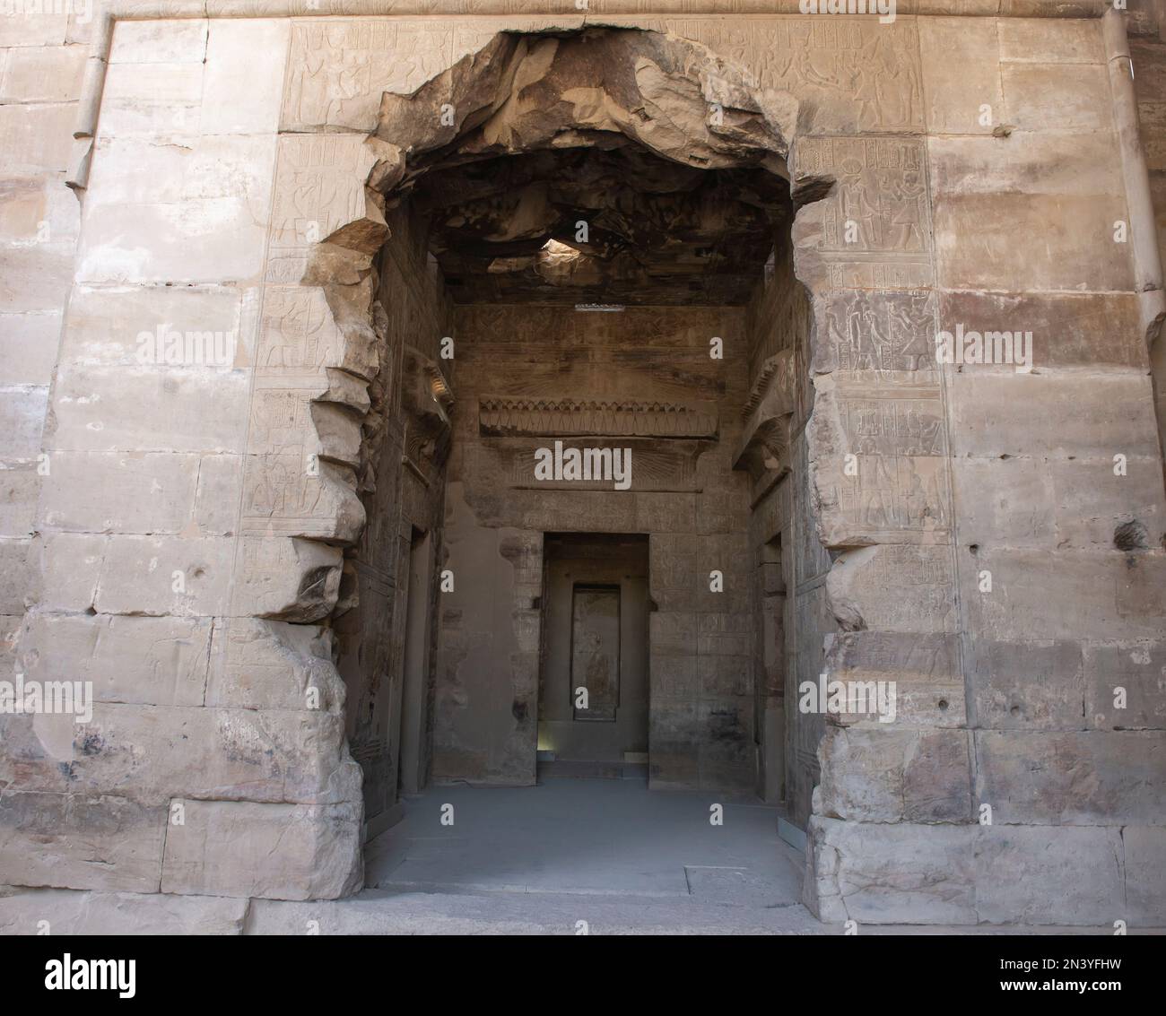 Hieroglypic carvings on entrance door wall at the ancient egyptian