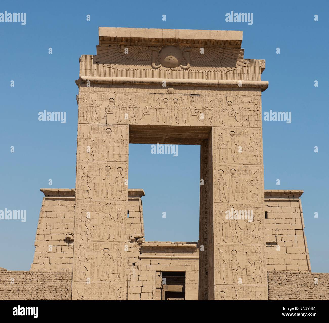 Hieroglypic carvings on entrance gate wall at the ancient egyptian