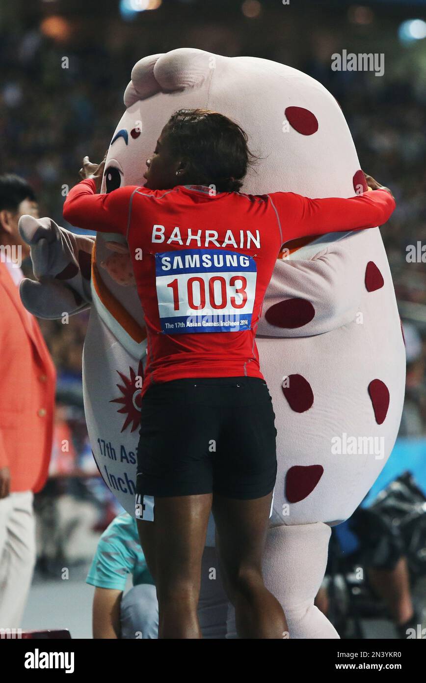 Bahrain's Oluwakemi Adekoya hugs the Games Mascot as she celebrates