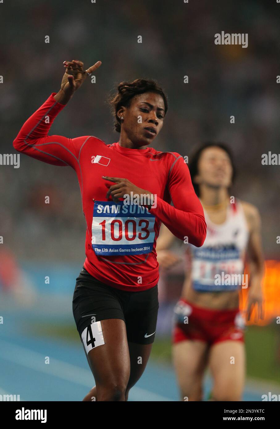 Bahrain's Oluwakemi Adekoya celebrates after the women's 400 meters