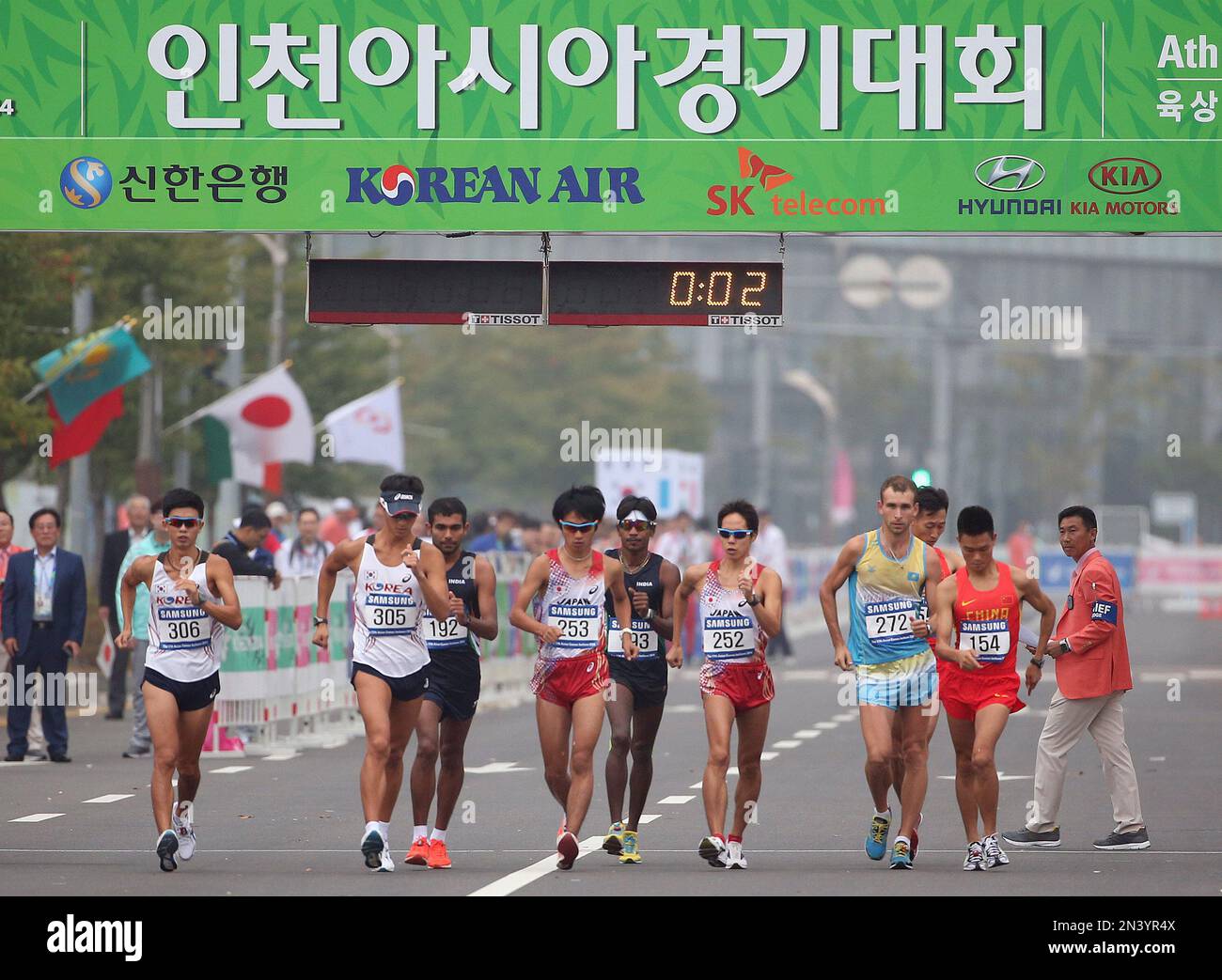 Walkers start during the men's 20km race walk at the 17th Asian Games ...