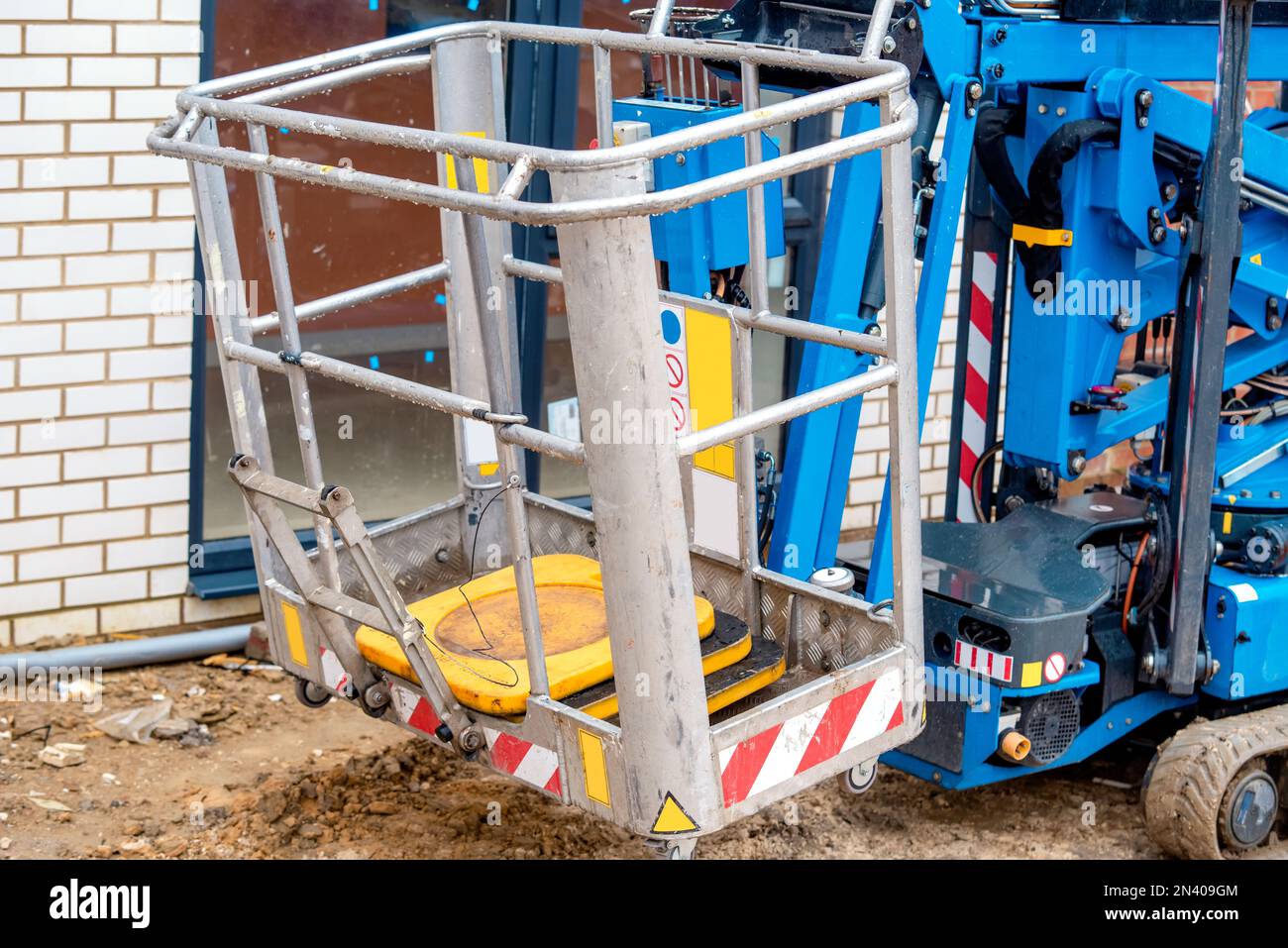 Blue mobile crawler elevating platform on building site Stock Photo