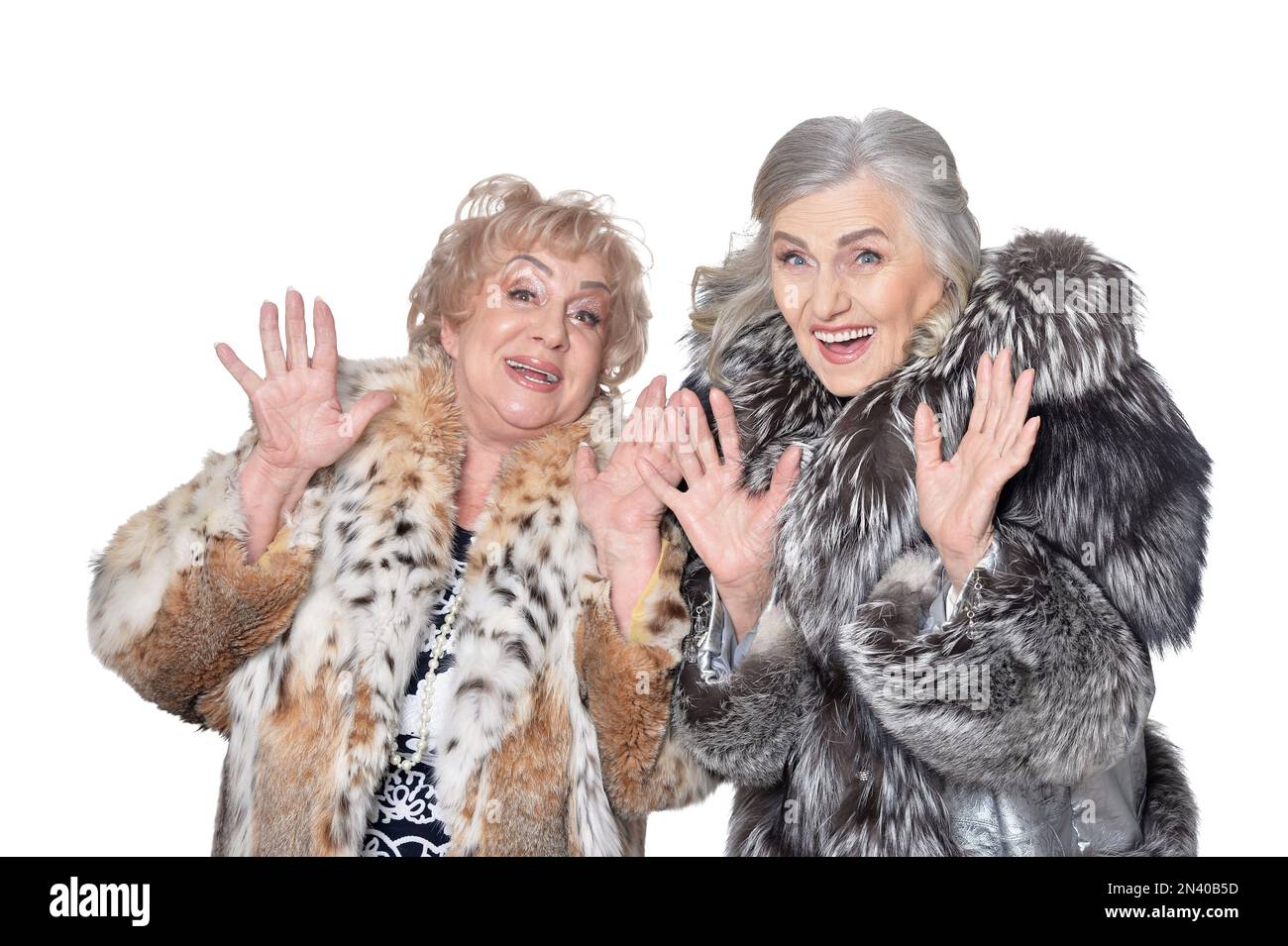 senior women in fur coats isolated on white background Stock Photo - Alamy