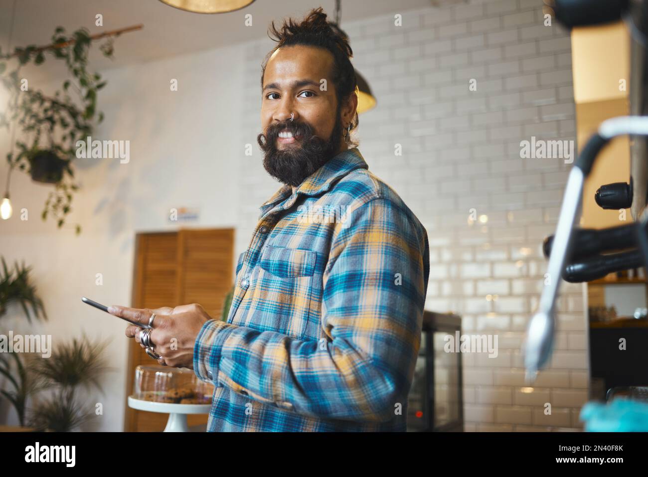 Coffee shop, phone and portrait of a man ordering a latte or espresso in the morning with a breakfast. Happy, smile and male with a cellphone to order Stock Photo