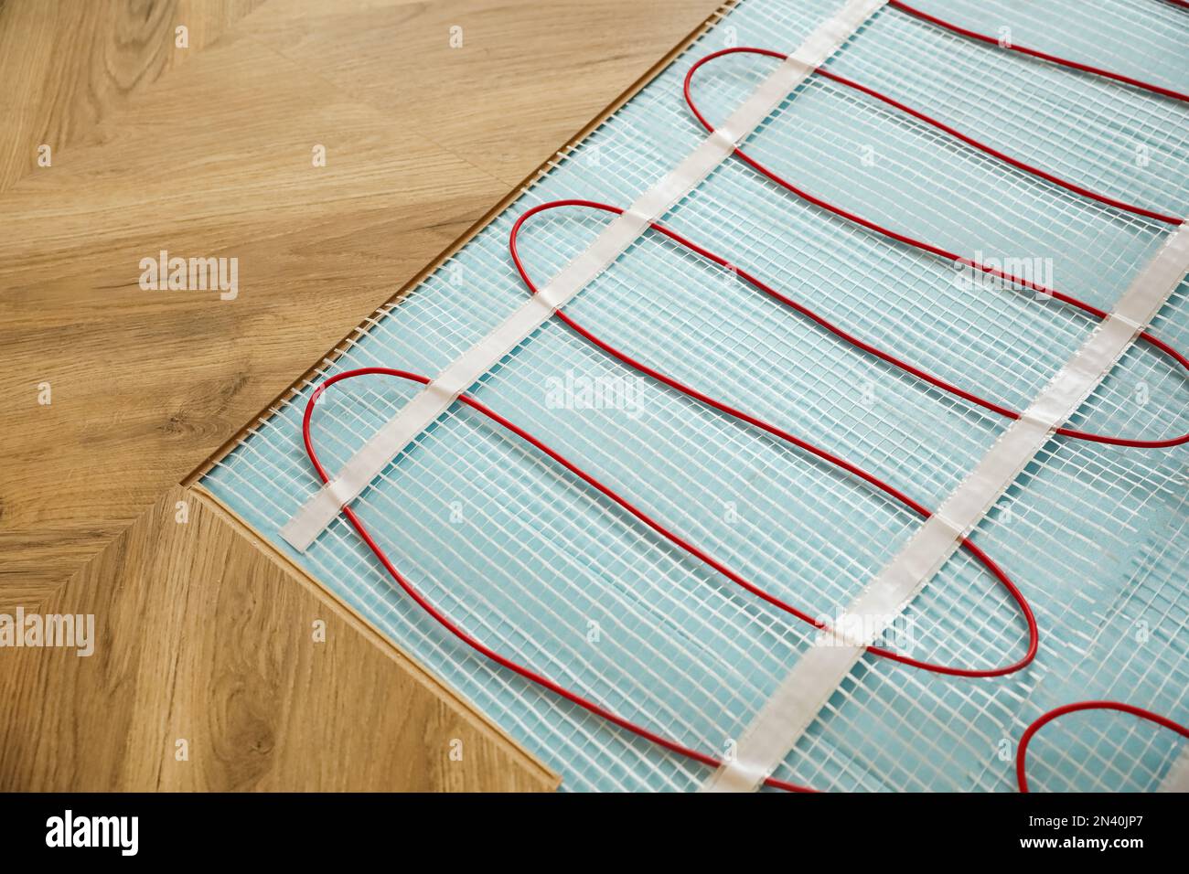 Installation of electric underfloor heating system indoors, closeup