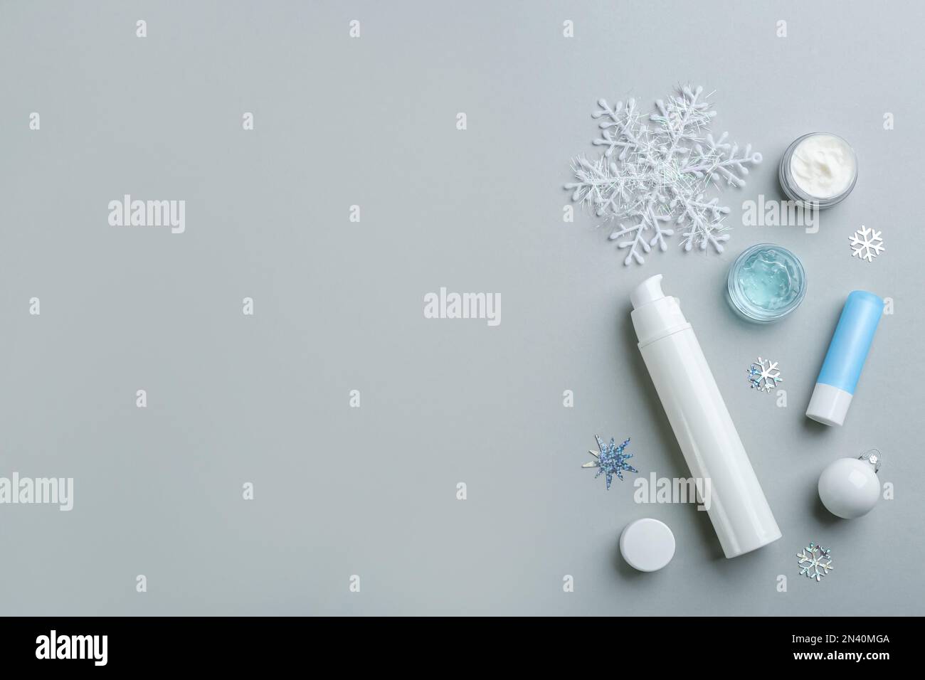 Flat lay composition with different cosmetic products on light grey ...