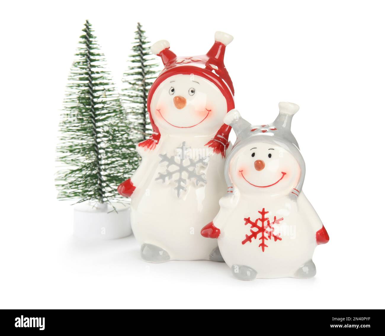 Decorative snowmen and Christmas trees on white background Stock Photo ...