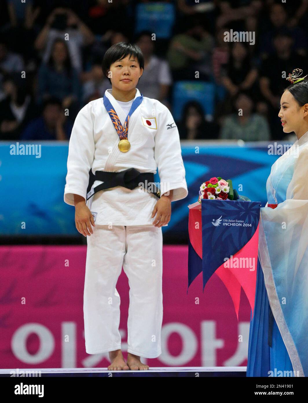 Japan's Anzu Yamamoto stands during the medal ceremony after winning