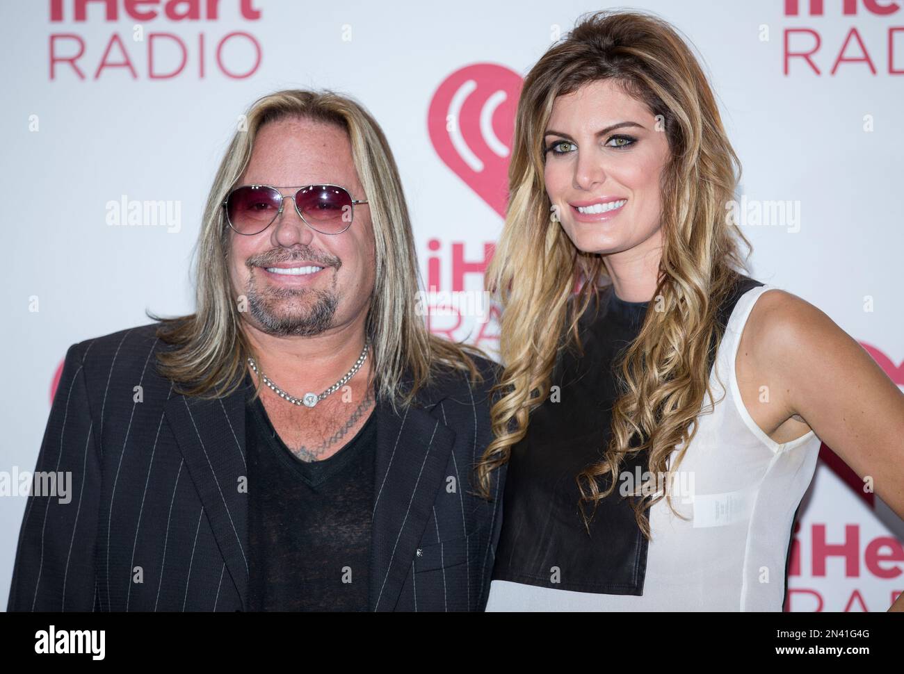Vince Neil with Girlfriend Rain Andreani arrive at the iHeartRadio