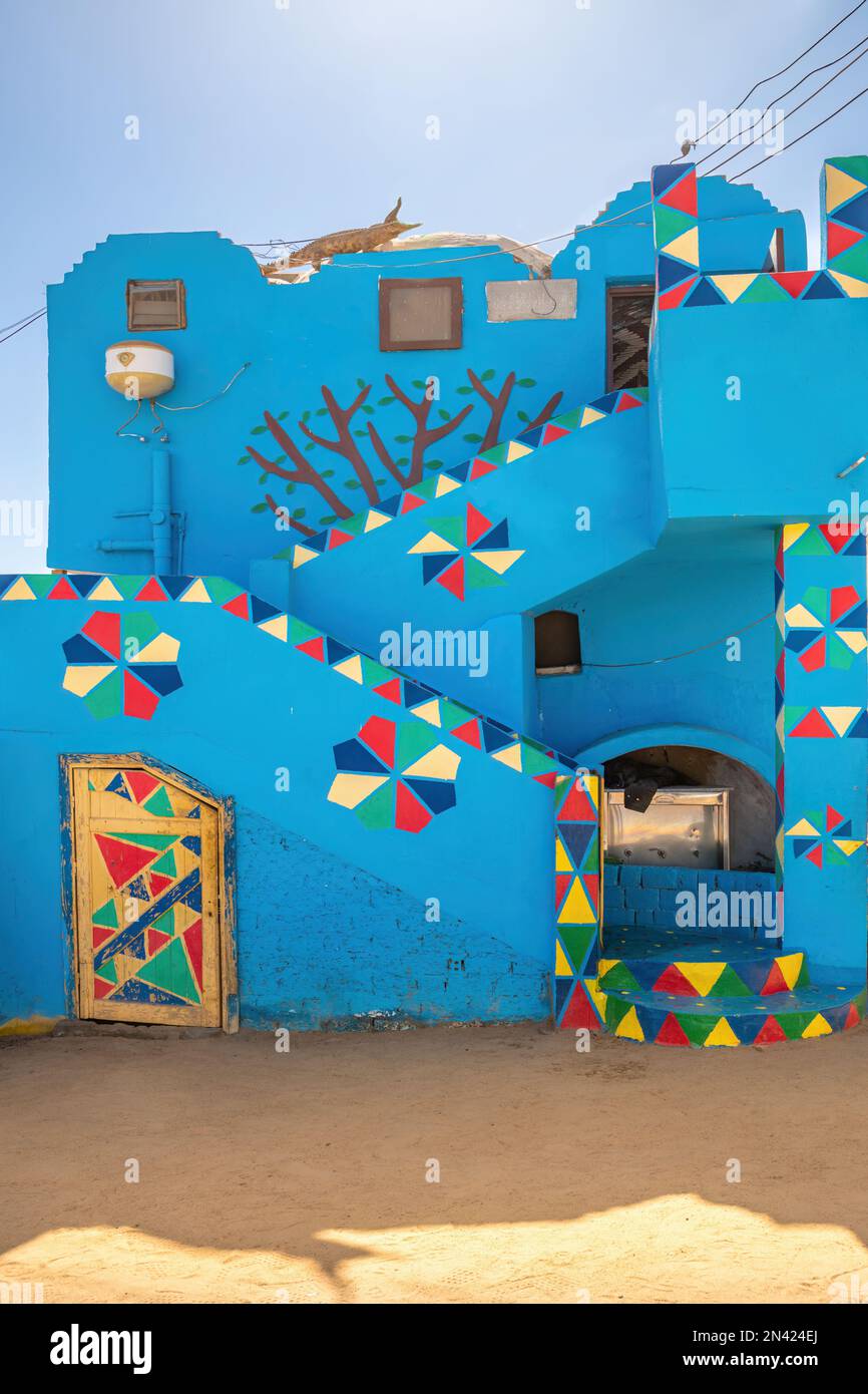 Aswan,Egypt; February 8, 2023 - Colourful Nubian houses in Aswan, Egypt Stock Photo